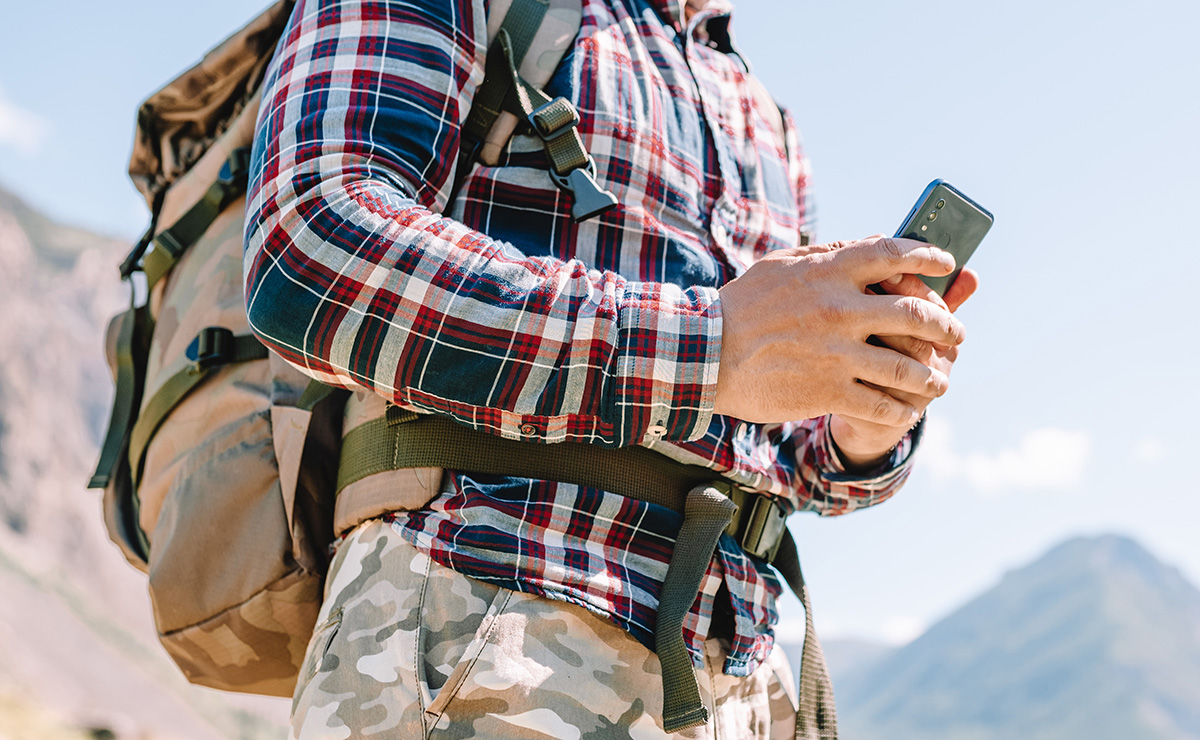Hiker on mobile device