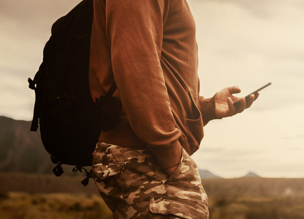 Hiker using mobile device